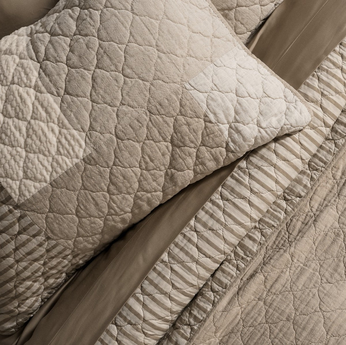 Panorama Patchwork Quilt styled on a bed, Nest Essentials Canada